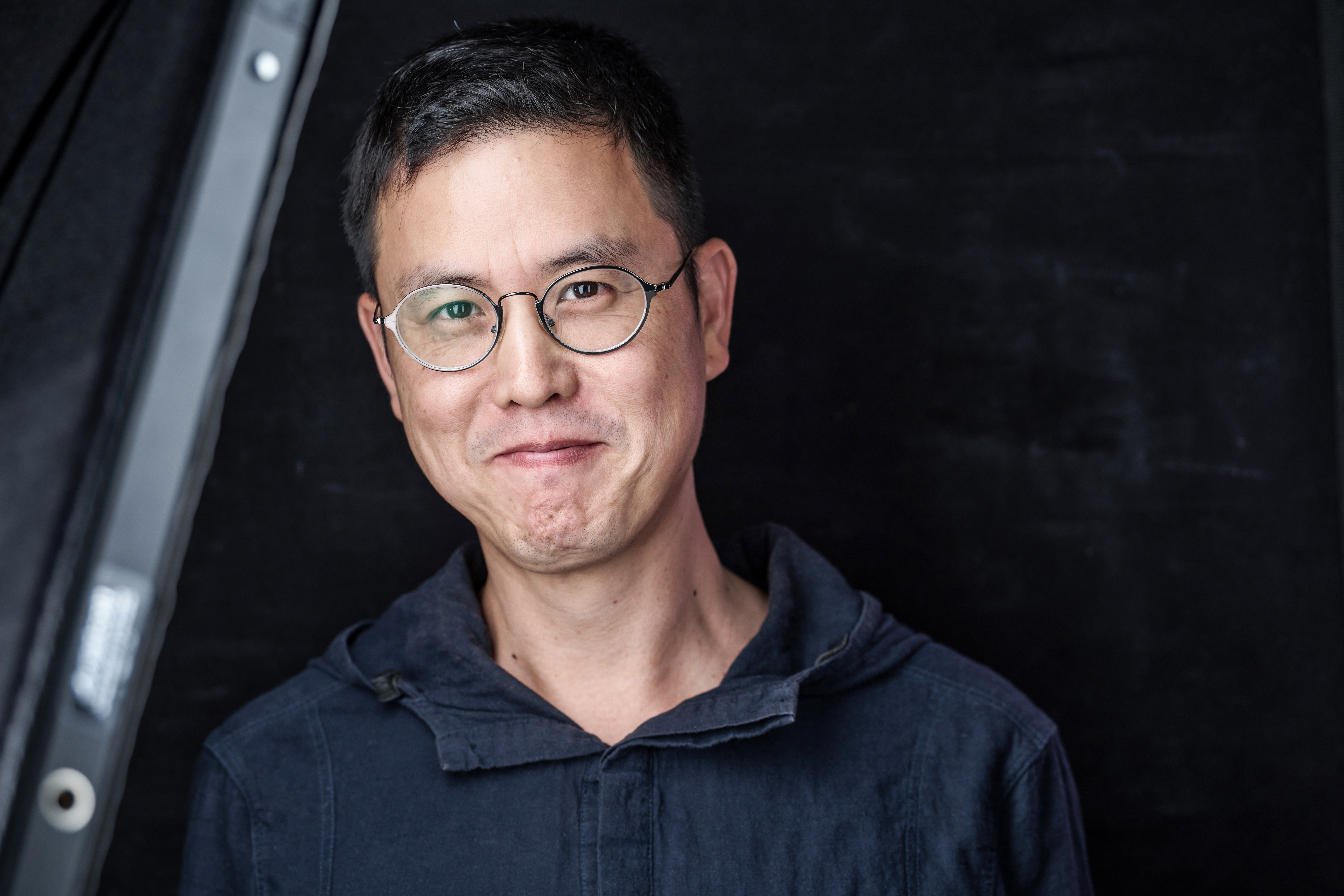 Dongryul Lee standing in front of a backdrop Dongryul Lee standing in front of a backdrop